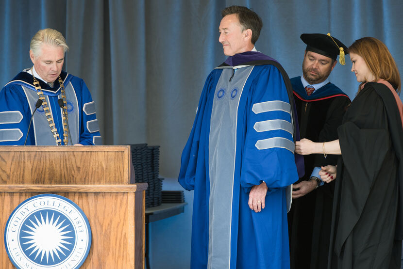 Greg Powell P’15 receives an honorary degree from President David A. Greene at Commencement in 2018. A native of Waterville, Powell is chairman of the Harold Alfond Foundation. 