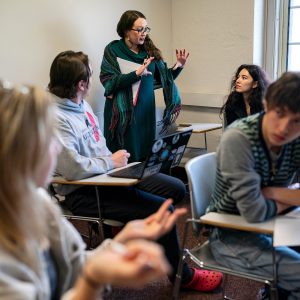 Tiffany Miller, assistant professor of Spanish, helps students during her SP135: Indigenous Latin America class in Lovejoy Building Thursday, April 20, 2023.