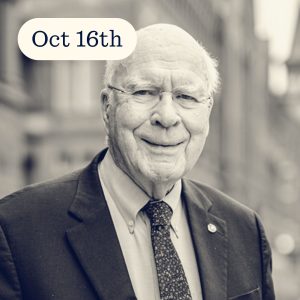 Portrait of a smiling elderly man in a suit and tie, outdoors with a blurred building background, featuring the date Oct 16th.