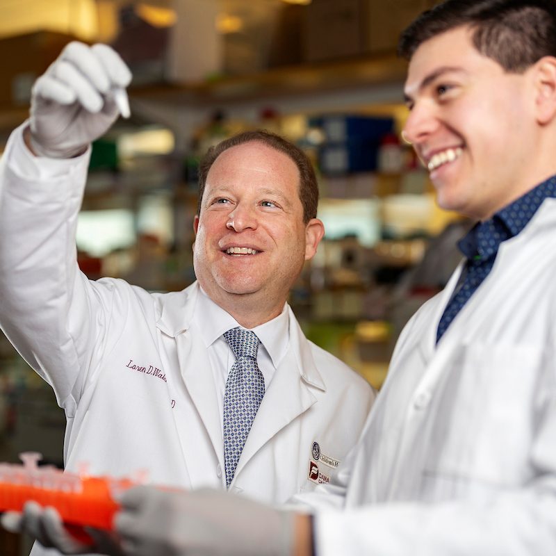 Loren Walensky, Principal Investigator, Principal Investigator, and Attending Physician in the Department of Pediatric Oncology at the Dana-Farber/Boston Children's Cancer and Blood Disorders Center, works in the lab with Tommy DeAngelo ’22, research technician