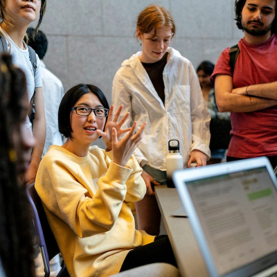 Student speaking with other students