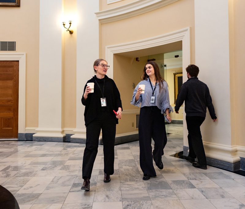 Lillian Ranco ’26 and Gabrielle Lewis ’28 walk back to their office in the Maine State House. The students spent Jan Plan doing an internship with the Senate Majority Office.